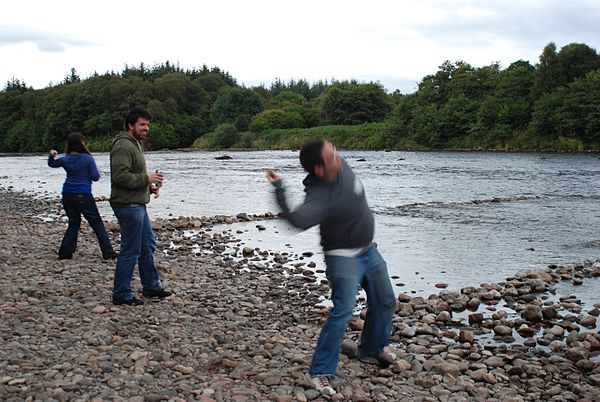 Throwing of stones into the river