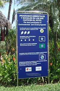 A hotel sign showing the voluntary certification programs the hotel has passed or is associated with. Shown are a four star Bandera Azul Ecologica and a three leaves CST Program. Tourism Certification Programs CRC 07 2009 6275.jpg