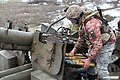 Український артилерист в "рудій" версії камуфляжа ММ-14 (січень 2023)