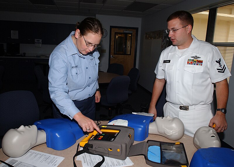 File:US Navy 061016-N-8544C-001 Hospital Corpsman 2nd class Nicholas Huso instructs Mass Communication Specialist 2nd Class Denise Ordonez how to properly operate an automated external defibrillator (AED).jpg