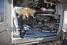 US Navy 071211-N-9623R-006 Seabees from Naval Mobile Construction Battalion (NMCB) 17 assist in loading fellow Seabees into a Blackhawk medical evacuation helicopter (MEDAVAC) during a mass casualty drill.jpg