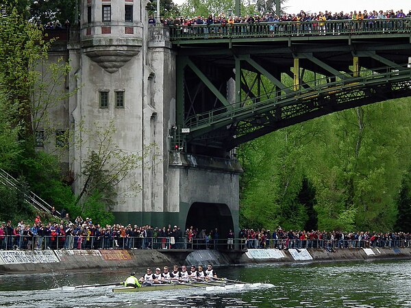 University of Washington men's crew competes in the 25th Annual Windermere Cup during Opening Day of Boating Season. Montlake Bridge is in the backgro