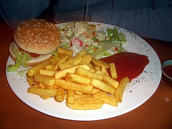Order from a vegetarian deli: veggie burger with French fries and salad