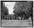 View of Port Gamble residential district, facing northwest across intersection of Rainier Avenue with Pope Street. House no. 11 in left foreground, Jackson House, house no. 10 in center HAER WA-135-7.tif