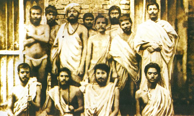 Group photo taken on 30 January 1887 In Baranagar Math, Kolkata. Standing: (l–r) ) Swami Shivananda, Swami Ramakrishnananda, Swami Vivekananda, Randhu
