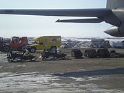 Loading Humvee in Cambridge Bay into C130 prior to airlift. The 109th Airlift Squadron flew the Humvee to Resolute Bay Airport.