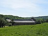 Le site formé par l'ancienne abbaye d'Aulne et les terrains environnants y compris la ferme