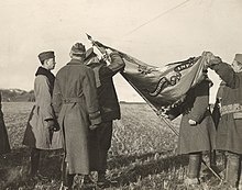 General Joseph Dickman pins the french Croix de Guerre to the 38th flag in 1919 111-SC-44917 - NARA - 55248594-cropped.jpg