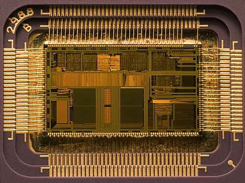 Macro shot of an Intel 80486DX2 CPU die in its packaging. The actual size of the die in the center is 12×6.75 mm.