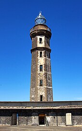 The main building and tower were buried by ash and rock to the point that today only the second-floor is visible above ground Acores 2010-07-18 (5036381597).jpg