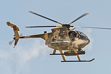 A MD-530G Scout Attack Helicopter. Six have been purchased for the Malaysian Army Air Corp's use in ESSZONE. Afghan Air Force MD-530F helicopter fires machine guns.jpg