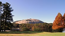 Stone Mountain is a quartz monzonite dome monadnock and the site of Stone Mountain Park near Stone Mountain, Georgia. Autumn in Stone Mountain Park.jpg