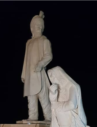 Statue of a Baloch man and woman with Balochi clothing -  Zahedan