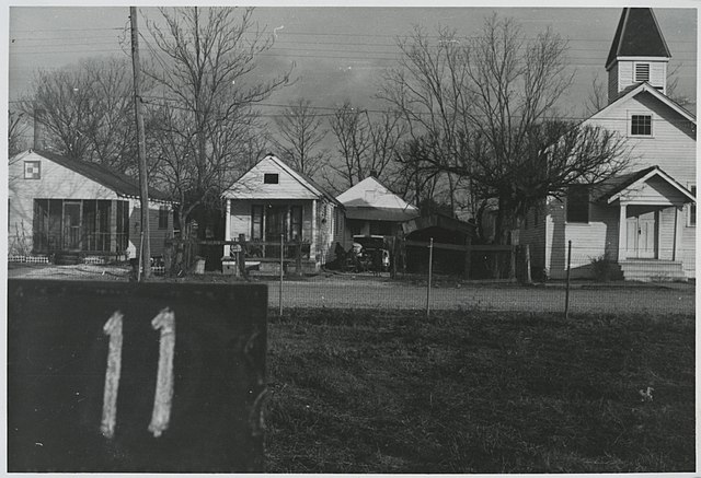 Battle Ground Baptist Church and neighboring shotgun-style houses, Fazendeville, Louisiana, 1960