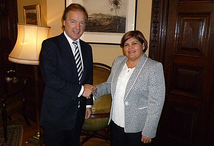 High Commissioner of Belize to the UK meets with the British Minister of State for Foreign and Commonwealth Affairs. High Commissioners act as liaisons between the governments of the Commonwealth realms.