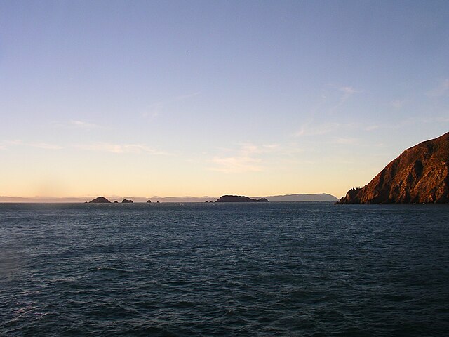 View from Cape Koamaru of the Brothers Islands with Wellington west coast on the horizon