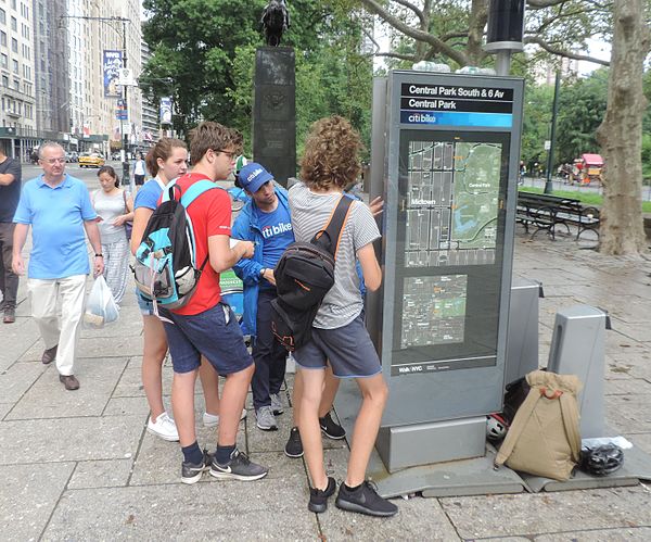 Tourists being instructed in using the system