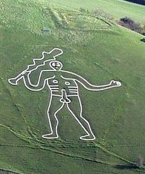 The Cerne Abbas Giant chalk figure, near the village of Cerne Abbas in Dorset, England, is made by a turf-cut.