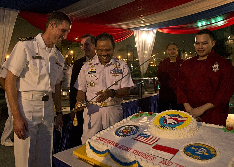 File:Cmdr. John Barnett, and Rear Adm. Arief Rudianto, admire the sword used for ceremonial cake cuttings during a reception.jpg