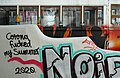 Image 692Corona fucked my summer, 2020 graffiti with a tram in the background, Calçada do Lavra, Lisbon, Portugal