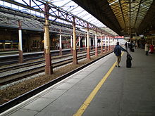 Platforms five and six are used primarily for express traffic along the West Coast Main Line. Crewe station platform 5.JPG