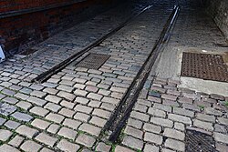A former railway track underneath a building in the Railway Dock in Kingston upon Hull.