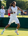 Dustin Brown competing in the first round of the 2015 Wimbledon Qualifying Tournament at the Bank of England Sports Grounds in Roehampton, England. The winners of three rounds of competition qualify for the main draw of Wimbledon the following week.