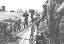 Portuguese troops board NRP Nuno Tristao frigate in Portuguese Guinea, during amphibious Operation Trident (Operacao Tridente), 1964 Embarque.jpg