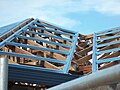 Metal purlins or roof battens screwed to roof gang-nail-type trusses
