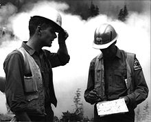 Two USFS foresters discussing firefighting tactics. Foresters discussing tactics at Buck Mtn-Oregon-1967.jpg