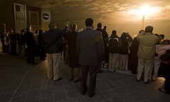 Guests look on from the terrace of Operations Support Building II during the launch.