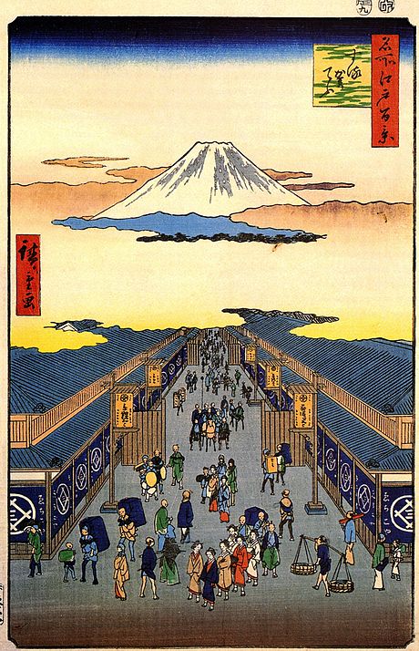 Surugacho (Suruga Street) (1856), from One Hundred Famous Views of Edo, by Hiroshige, depicting the Echigoya kimono and money exchange store with Mount Fuji in background. Currently, the Mitsui Main Building (三井本館), which houses Sumitomo Mitsui Banking Corporation, Mitsui Fudosan, The Chuo Mitsui Trust and Banking Co. and Mitsui Memorial Museum, is located on the right side of the street. Mitsukoshi department store is on the left side.