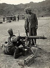 A British Indian Army Vickers machine gun crew in the North West Frontier, British India, 1940.
