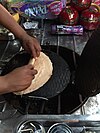 Street vendor at the Zócalo rolling a ''marquesita'', a sweet crunchy wafer filled with cheese, fruit, or chocolate