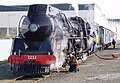 J 1211 being serviced before departure from Napier with one AG van, one A class and one AD class carriages in the Cato Blue livery.