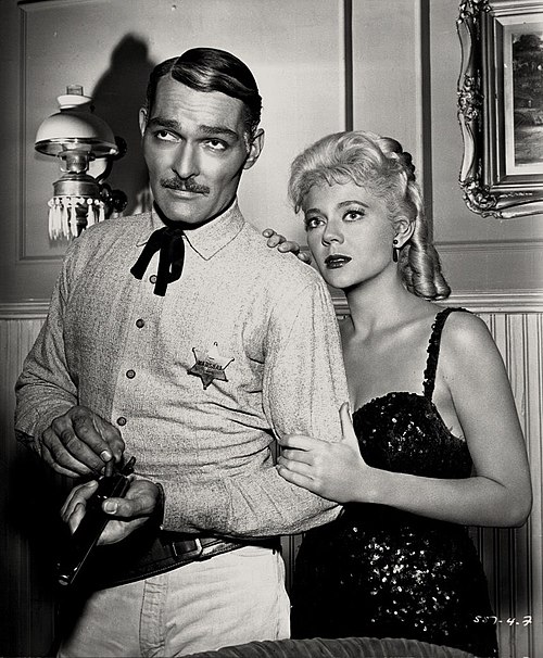 Russell with Peggie Castle, 1962