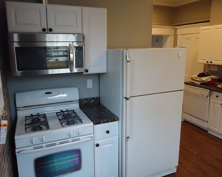 File:Kitchen renovation project cabinets finished microwave installed new floor painted walls and ceiling.JPG