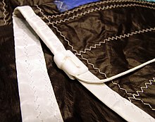 Leech line with jam cleat to control the tension on the leach of a foresail. Liekleine.jpg