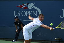 Youzhny in his third round match against John Isner at the 2010 US Open. He would go on to win the match in three sets Mikhail Youzhny at the 2010 US Open 01.jpg