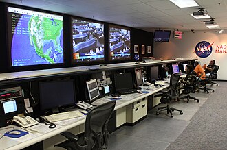 NASCOM control center in 2011 NASA Goddard engineers in the NASCOM control room.jpg