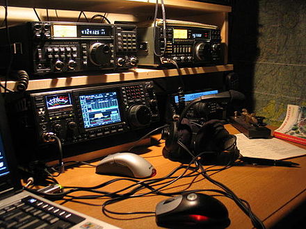 An amateur radio station comprising three Icom radios.