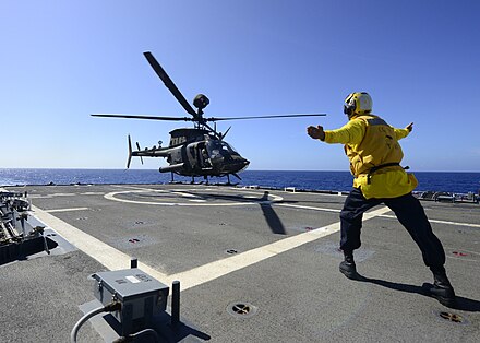 OH-58D of 2nd Squadron, 6th Cavalry Regiment, landing on USS Lake Erie