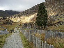 Plas Cwmllan (right) and Gladstone Rock (left) in Cwm Llan, looking along the Watkin Path