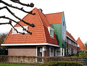 Huizenblok aan Purmerweg in Amsterdamse Schoolstijl, ontworpen door architect J. Boterenbrood.