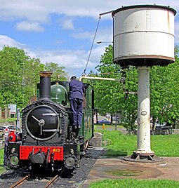 The water tower at Raven Square with No. 823 Countess of 1902 taking water before departing on a passenger train. Rly W&LR 823 Countess Welshpool 16.05.2015 edited-2.jpg