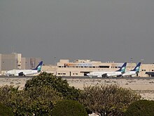 Saudi Aramco airplanes parked in the general aviation terminal, King Fahd International Airport.JPG