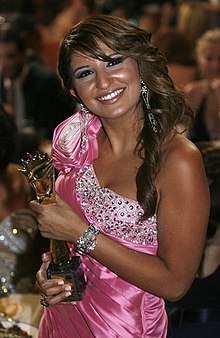 Shatha Hassoun in the Murex d'or Ceremony holding her trophy, 2008