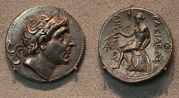 The Seleucid king Antiochos ("Aṃtiyako Yona Rājā" ("The Yona king Antiochos")) is named as a recipient of Ashoka's medical treatments, together with h