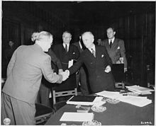 Secretary of State James F. Byrnes with Soviet Foreign Minister Vyacheslav Molotov during the Potsdam Conference, in Potsdam, 1945 Soviet foreign minister Vyacheslav Molotov, left, shakes hands with Secretary of State James Byrnes before the... - NARA - 198956.jpg