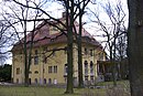 Country estate "Schloss Glienig", consisting of a villa, farm yard with storage facility, horse stable, residential and administrative building with stable construction, part of the distillery and open spaces belonging to the estate, park with tuff grotto, pump house, pathways and fences